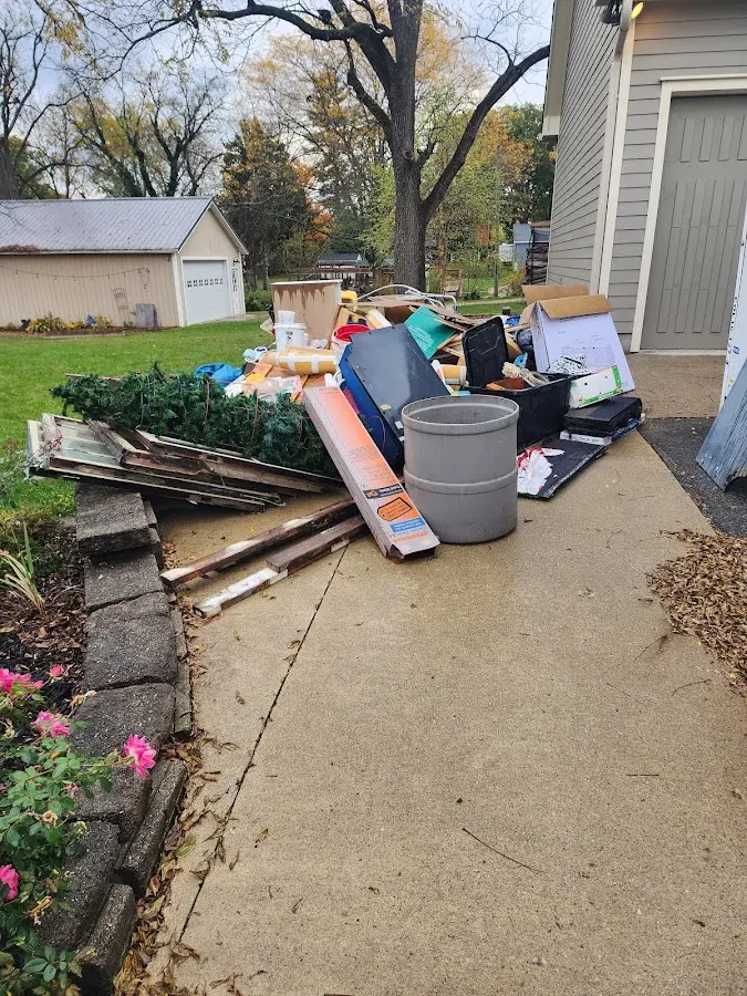 Dumpster being loaded with debris for 3 Yard Dumpster Rental in Fruitville